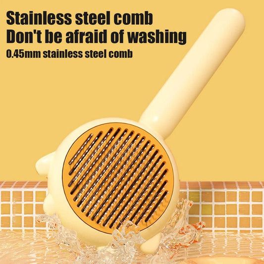 Stainless steel comb with water splashes on a yellow background