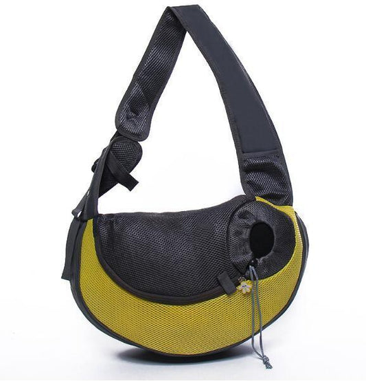Pet carrier with black mesh and yellow exterior on a white background