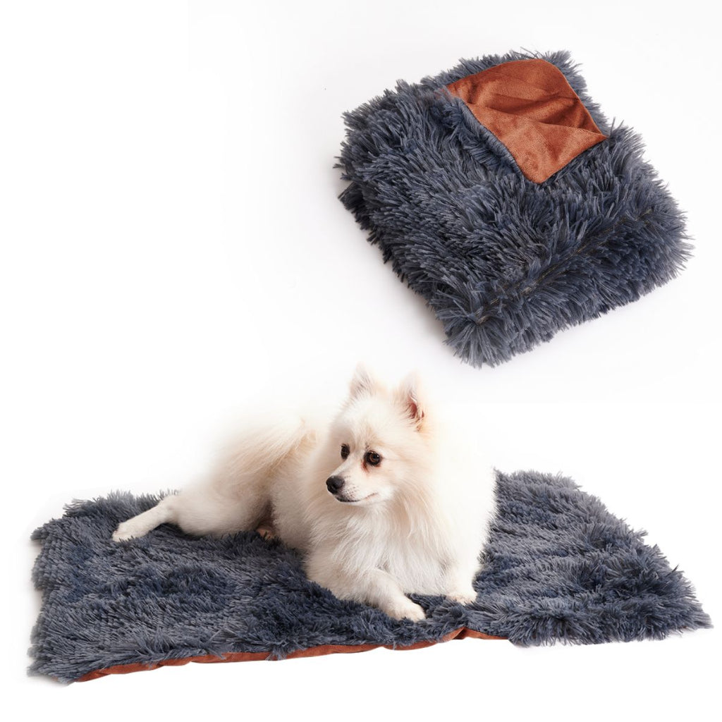 Fluffy gray pet mat with brown accents, featuring a small white dog on a white background.