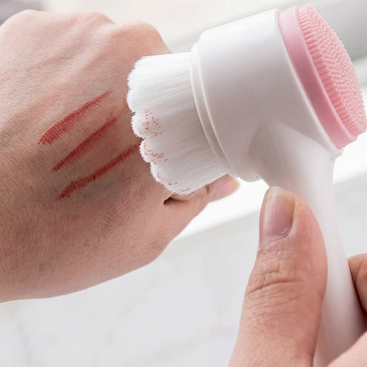 Person using a white and pink handheld device on their hand against a light background