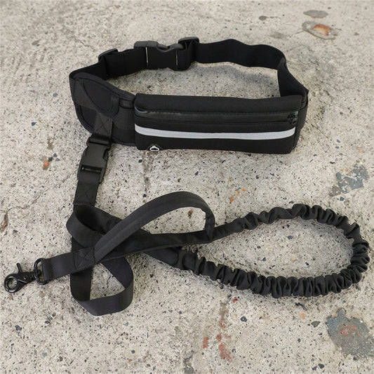 Black waist bag with reflective strip and bungee leash on a concrete surface